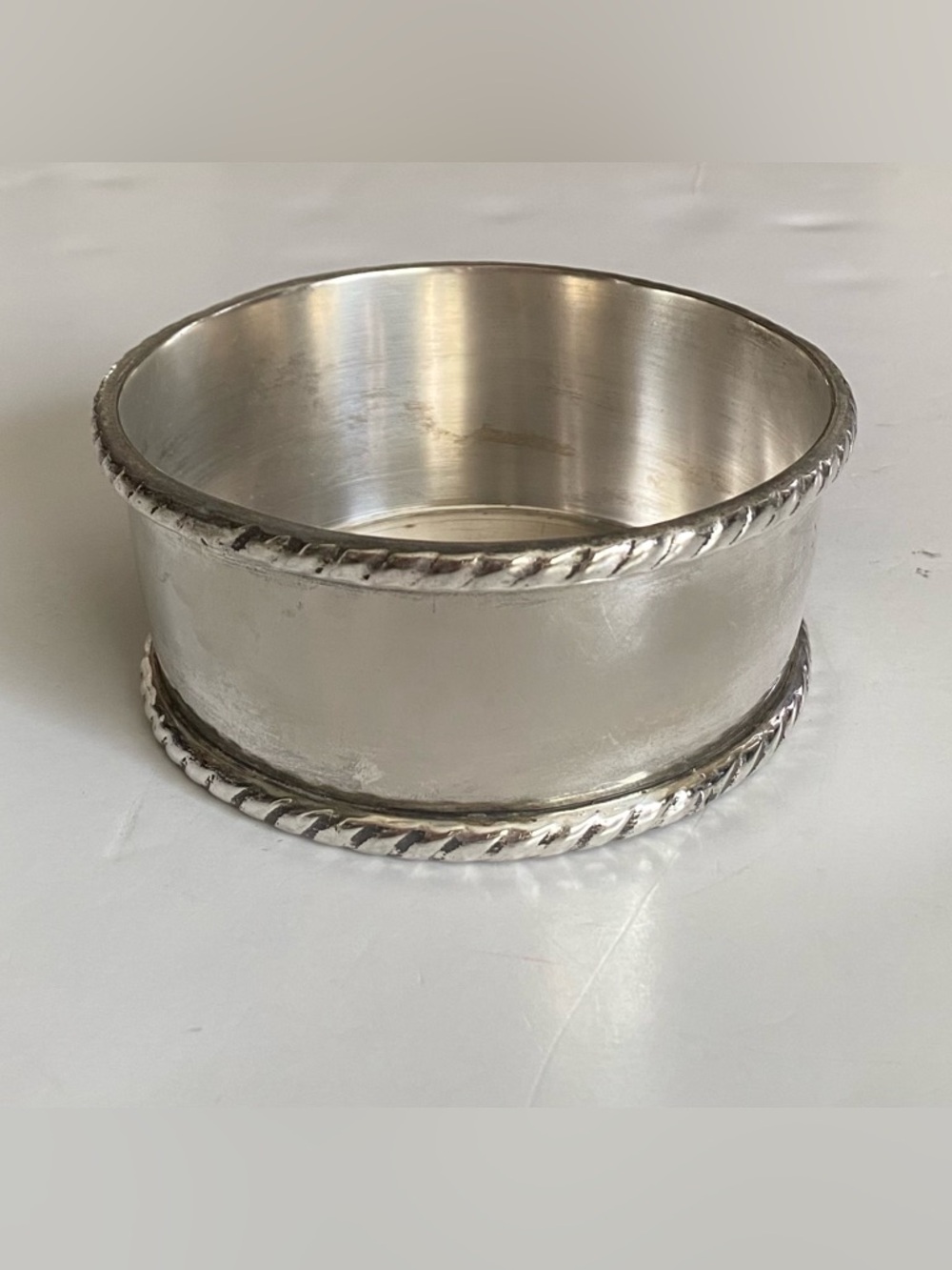 Pottery Barn wine holder in silverplate. Felted bottom